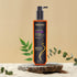 Sonama Naturals Keratin Hair Repair Shampoo bottle on a beige background with green leaves.